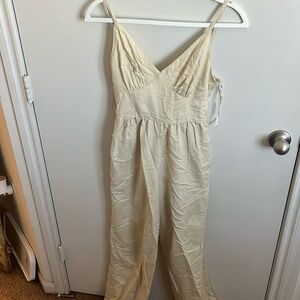 Light tan jumpsuit, small, tie back, v front